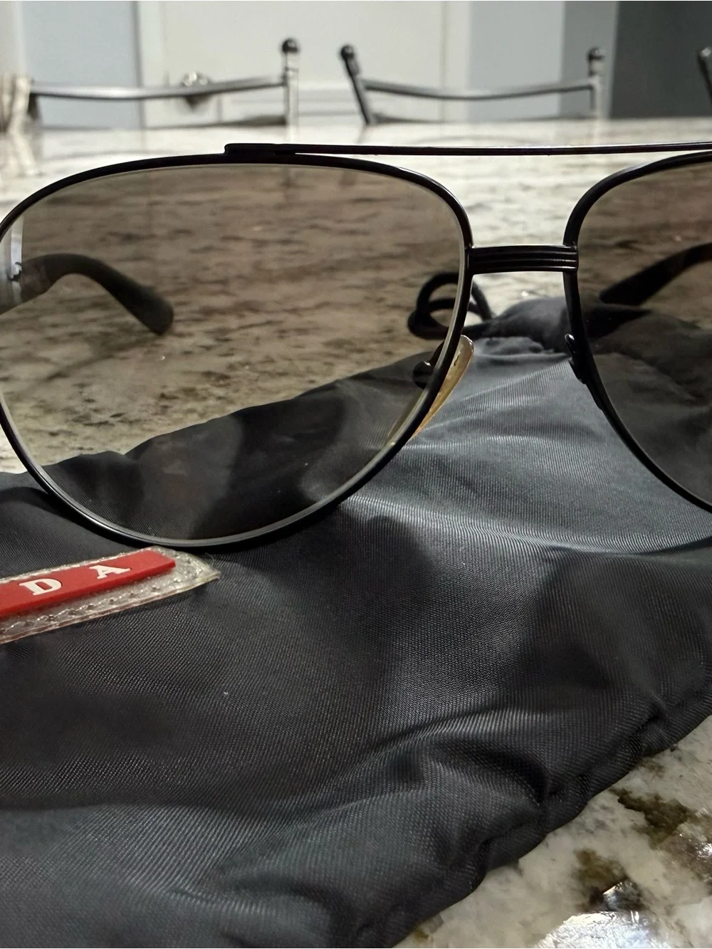 Prada Black Frame Sunglasses with Dark Lenses